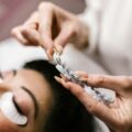 pexels-photo-7755525-7755525 Detailed view of eyelash extension procedure in salon setting.
